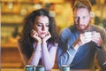 Young attractive couple having problems on date Royalty Free Stock Photo