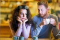 Young attractive couple having problems on date Royalty Free Stock Photo