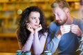 Young attractive couple having problems on date Royalty Free Stock Photo