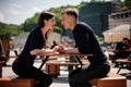 Young and attractive couple holding hands about to kiss over table in restaurant Royalty Free Stock Photo