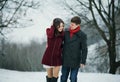 Young attractive couple, love in snowy Park Royalty Free Stock Photo