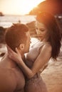 Young, attractive couple resting on a tropical beach Royalty Free Stock Photo