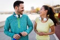 Young attractive couple running outside on sunny day Royalty Free Stock Photo