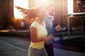 Young attractive couple running outside on sunny day Royalty Free Stock Photo