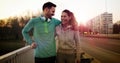 Young attractive couple running outside on sunny day Royalty Free Stock Photo