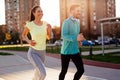 Young attractive couple running outside on sunny day Royalty Free Stock Photo