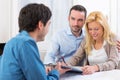 Young attractive couple signing contract Royalty Free Stock Photo