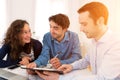 Young attractive couple signing contract Royalty Free Stock Photo