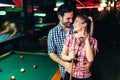 Young attractive couple on date in snooker club