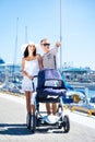 Young and attractive couple walking with their baby Royalty Free Stock Photo