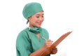 Young attractive and efficient Asian Chinese medicine doctor woman or hospital nurse in protective face mask and green gown during