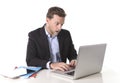 Young attractive European businessman working in stress at office desk computer looking monitor in shock Royalty Free Stock Photo