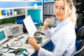 Female electronic engineer checking electronic circuit in laboratory Royalty Free Stock Photo