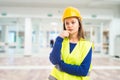 Young attractive female engineer thinking Royalty Free Stock Photo