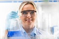 Young attractive female scientist just discovered the new chemical substance