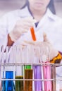 Young attractive female scientist mixing chemicals Royalty Free Stock Photo