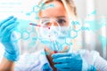 Young attractive female scientist researching in the laboratory Royalty Free Stock Photo