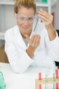 young attractive female scientist researching in laboratory Royalty Free Stock Photo