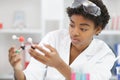 young attractive female scientist researching in laboratory Royalty Free Stock Photo