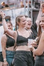 Young attractive female smiling and dancing during music festival Electrifinity in Bad Aibling