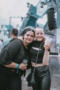 Young attractive females smiling during the electronic music festival Electrifinity in Bad Aibling