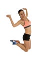 Young attractive fitness trainer woman jumping high excited and happy Royalty Free Stock Photo