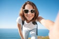 Young attractive funny girl in a white T-shirt and jeans against Royalty Free Stock Photo