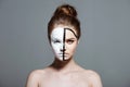 Young attractive girl with creative white and black bodyart on face, Royalty Free Stock Photo