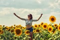 Young attractive girl in the field with sunflowers Royalty Free Stock Photo