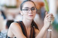 Young attractive girl in glasses in cafe Royalty Free Stock Photo