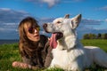 Young attractive girl with her pet dog at seaside Royalty Free Stock Photo