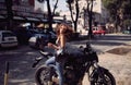 Young attractive girl with the motorbike enjoys the weather Royalty Free Stock Photo