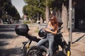 Young attractive girl with the motorbike Royalty Free Stock Photo