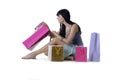 Young attractive girl sitting with all her new purchases Royalty Free Stock Photo