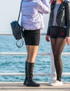 Young attractive girls in short skirt and pants enjoying a walk on the seafront, in Constanta Romania Royalty Free Stock Photo