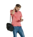 Young attractive guy acting surprised while using his mobile phone Royalty Free Stock Photo