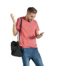 Young attractive guy acting surprised while using his mobile phone Royalty Free Stock Photo