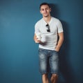 Young attractive handsome man in white t-shirt