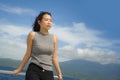 Young attractive and happy Asian Chinese woman on excursion ship or ferry enjoying sea breeze on summer holiday sea boat trip Royalty Free Stock Photo