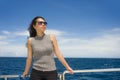 Young attractive and happy Asian Chinese woman on excursion ship or ferry enjoying sea breeze on summer holiday sea boat trip Royalty Free Stock Photo