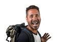 Young attractive and happy backpacker man on his 30s or 40s carrying backpack going for holidays travel in tourism and exploring Royalty Free Stock Photo