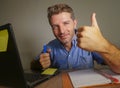 Young attractive and happy business man working at home office smiling confident and positive in successful work concept giving th Royalty Free Stock Photo