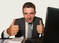 Young attractive and happy businessman in suit and necktie working on office laptop computer desk isolated on white background Royalty Free Stock Photo