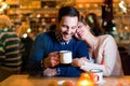 Young attractive couple on date in bar