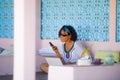 Young attractive and happy hipster Asian woman working with laptop computer at relaxing outdoors workplace enjoying success as int Royalty Free Stock Photo