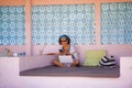 Young attractive and happy hipster Asian woman working with laptop computer at relaxing outdoors workplace enjoying success as int Royalty Free Stock Photo