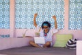 Young attractive and happy hipster Asian woman working with laptop computer at relaxing outdoors workplace enjoying success as int Royalty Free Stock Photo