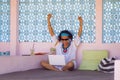 Young attractive and happy hipster Asian woman working with laptop computer at relaxing outdoors workplace enjoying success as int Royalty Free Stock Photo