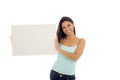 Young attractive and happy hispanic woman holding blank billboard with copy space Royalty Free Stock Photo