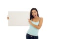 Young attractive and happy hispanic woman holding blank billboard with copy space Royalty Free Stock Photo